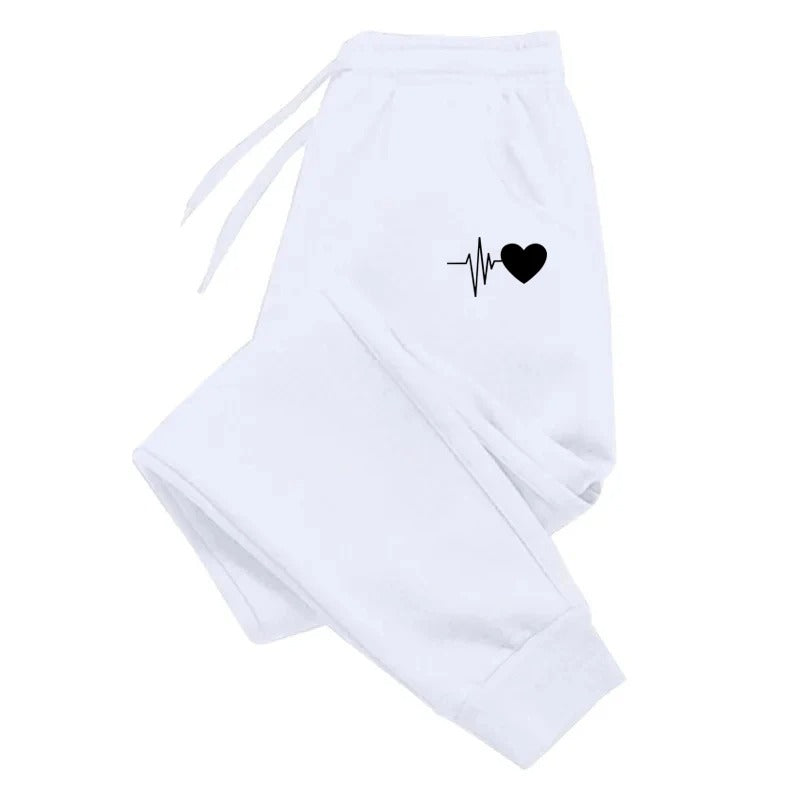 Komfortable sporty joggebukser for kvinner, grå, med praktiske sidelommer og elastisk midje.