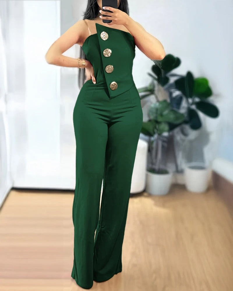 Rygg av kvinners asymmetrisk bandeau-jumpsuit, elegant for festantrekk.
