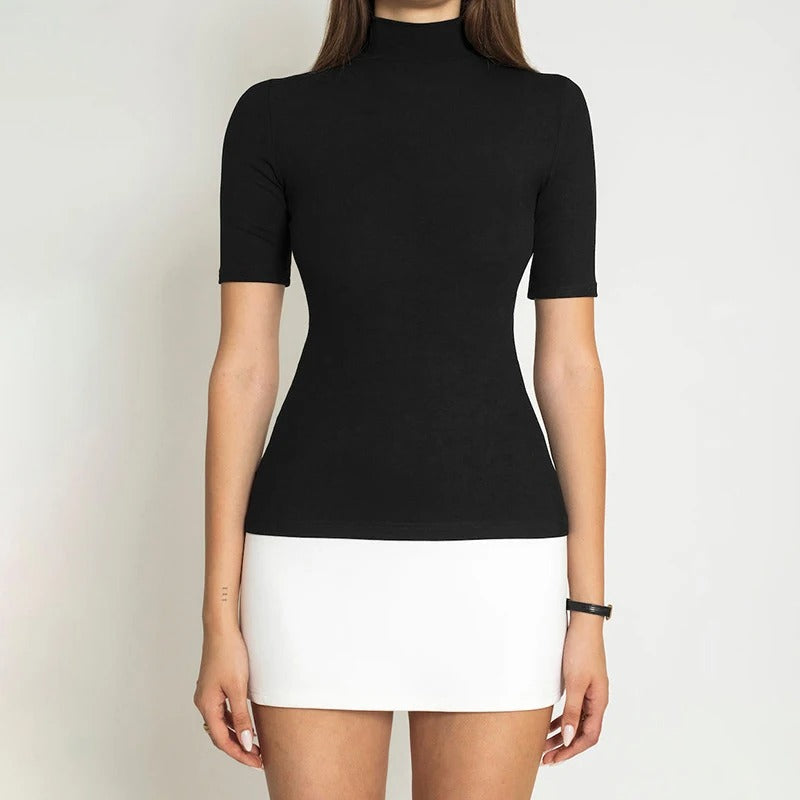 Moderne sort/hvit bodycon kjole med høy hals, patchwork og halv erme. Figursydd festantrekk og kontorkjole for damer.
