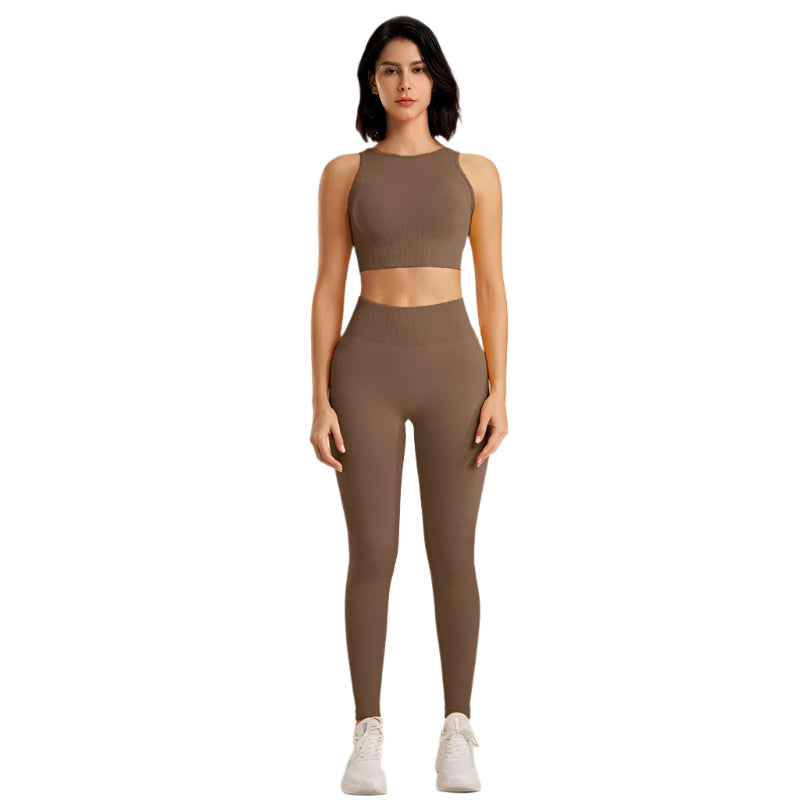 Kvinners sømløse yogasett med høy midje leggings og matchende topp. Optimal komfort for trening og yoga.