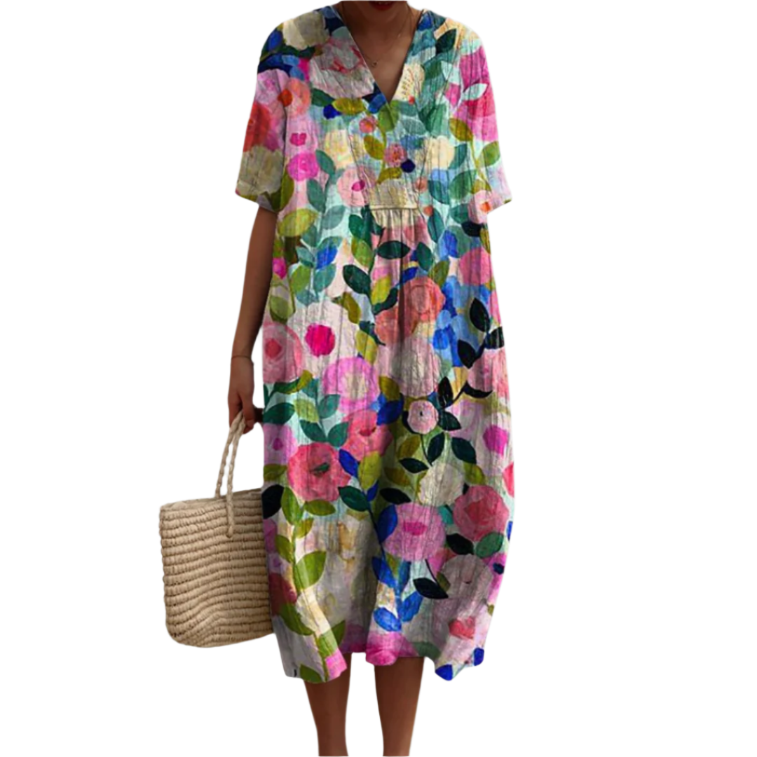 Lett sommerkjole for dame med blomstertrykk og V-hals, perfekt for varme dager. LĂžs og komfortabel passform.