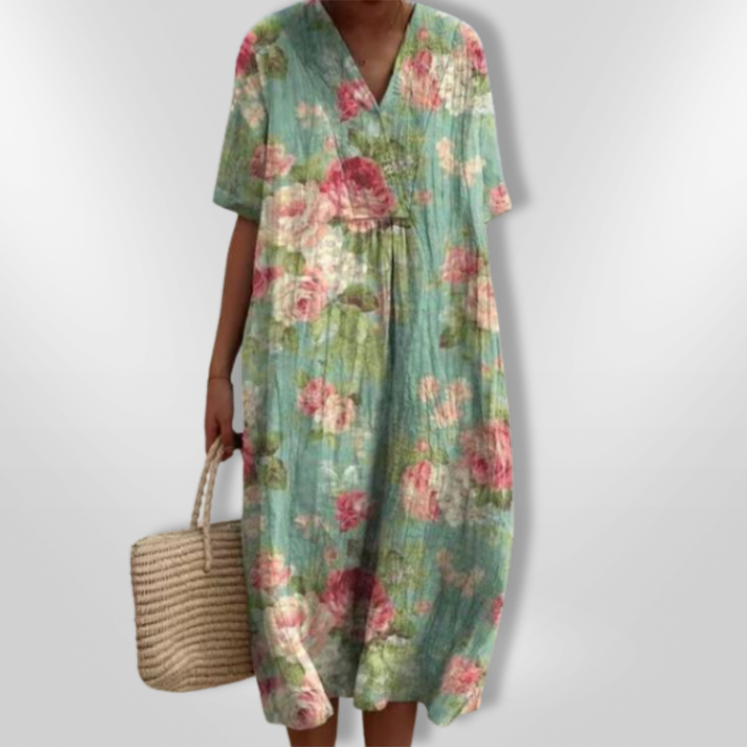 Feminine og komfortable: Sommerkjole med blomstertrykk, V-hals og løs passform. Ideelt for dame.