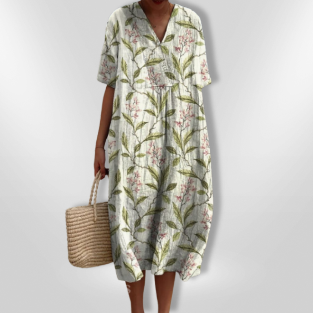 Lett og luftig damekjole med blomstertrykk og V-hals, en favoritt for sommerens varme dager.