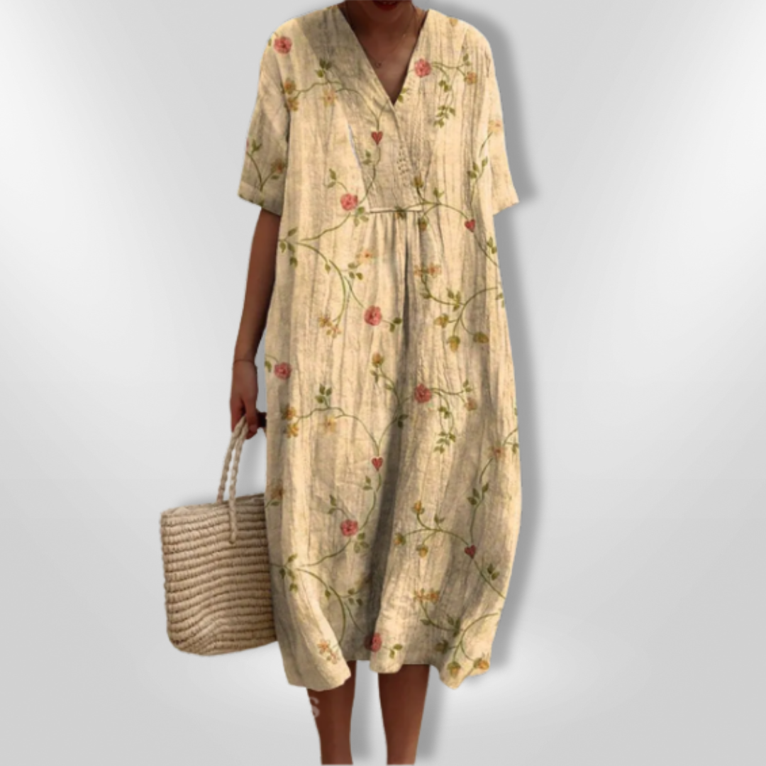 Feminine klær: Sommerkjole med blomstertrykk og V-hals, lett og behagelig stoff. Damekjole.