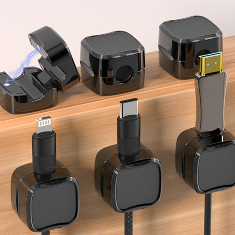 "Magnetisk ledningsholder som organiserer kabler effektivt, med stilren design og sikker lås for tekniske enheter."