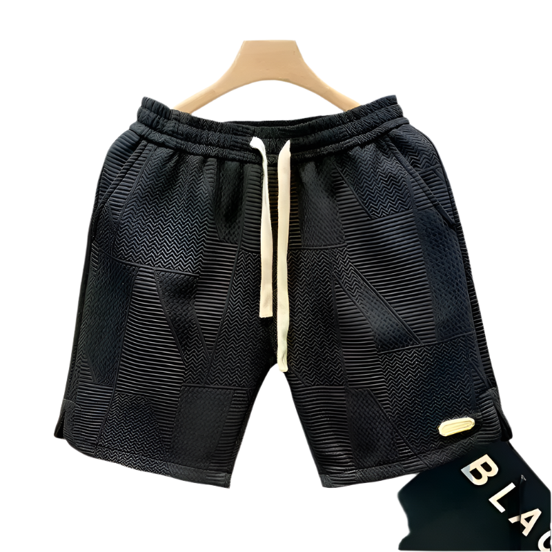 Menns løse sportsshorts i komfortabelt stoff for trening, fritid og hverdag. Ideell for sommeraktiviteter.