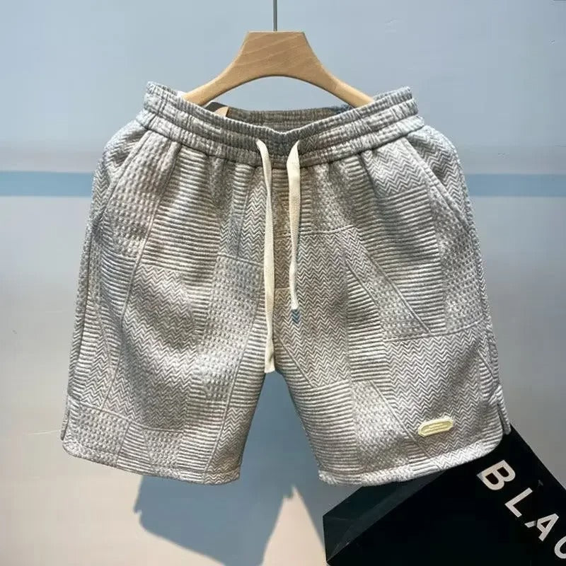 Slitesterk herresportsshorts med pustende stoff, perfekt for intens trening eller komfortabel sommerbruk.