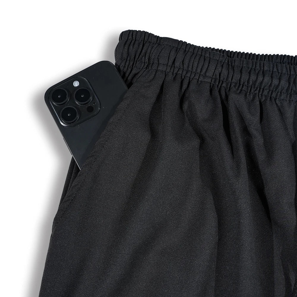 Herre joggebukser med praktiske lommer og justerbar snøring, ideelle for trening og hverdagskomfort.