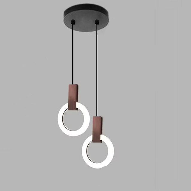 "Minimalistisk LED-pendellampe i sirkulær design, gir varm belysning med nordisk eleganse, ideell for moderne rom."