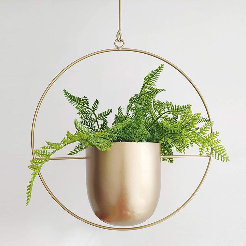 Estetisk veggmontert løsning for grønneplanter, denne minimalistiske planteholderen er ideell for interiørdesign.