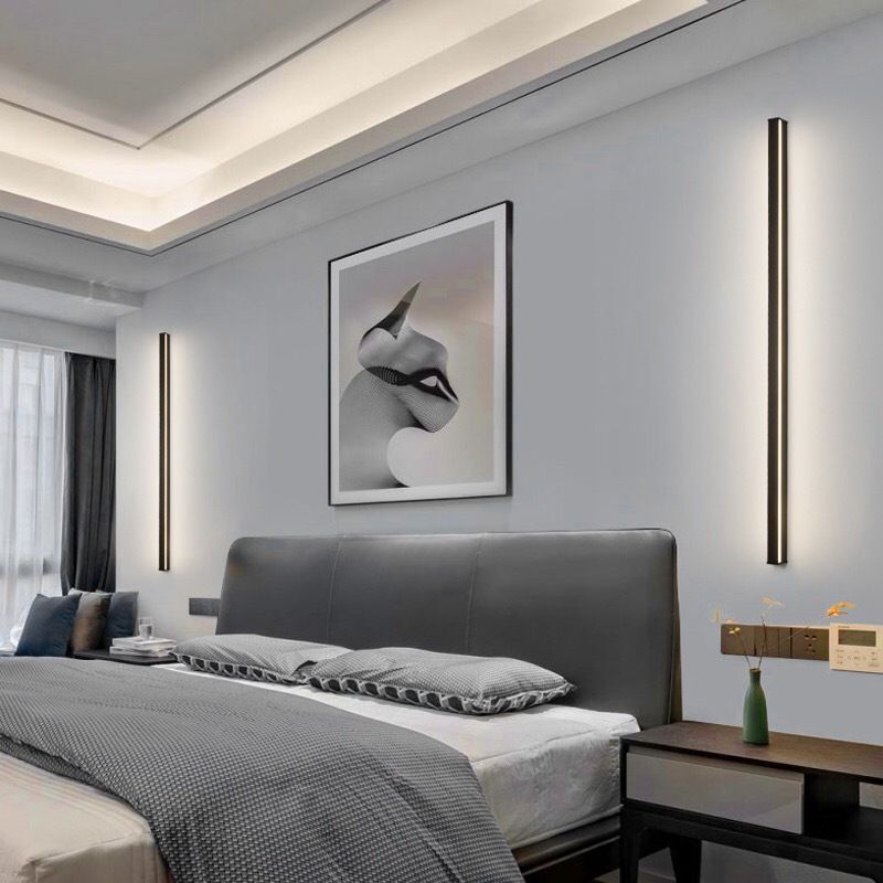 Hvit, stilren LED vegglampe i minimalistisk, geometrisk design. Moderne innendørs belysning.