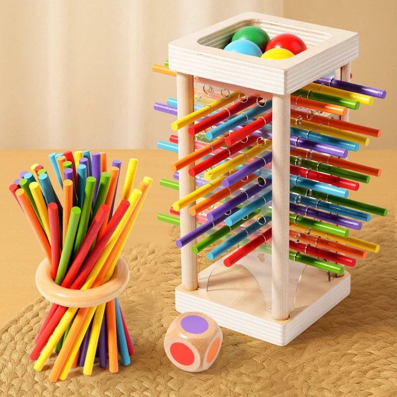 Barn arrangerer tre tellestenger på et bord, lærer å telle og grunnleggende matematikk med Montessori-leker.