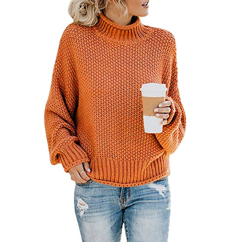 Elegant oversized strikkegenser for kvinner med moderne høy hals og flatterende batwing-ermer. Ideell for hverdagsbruk.