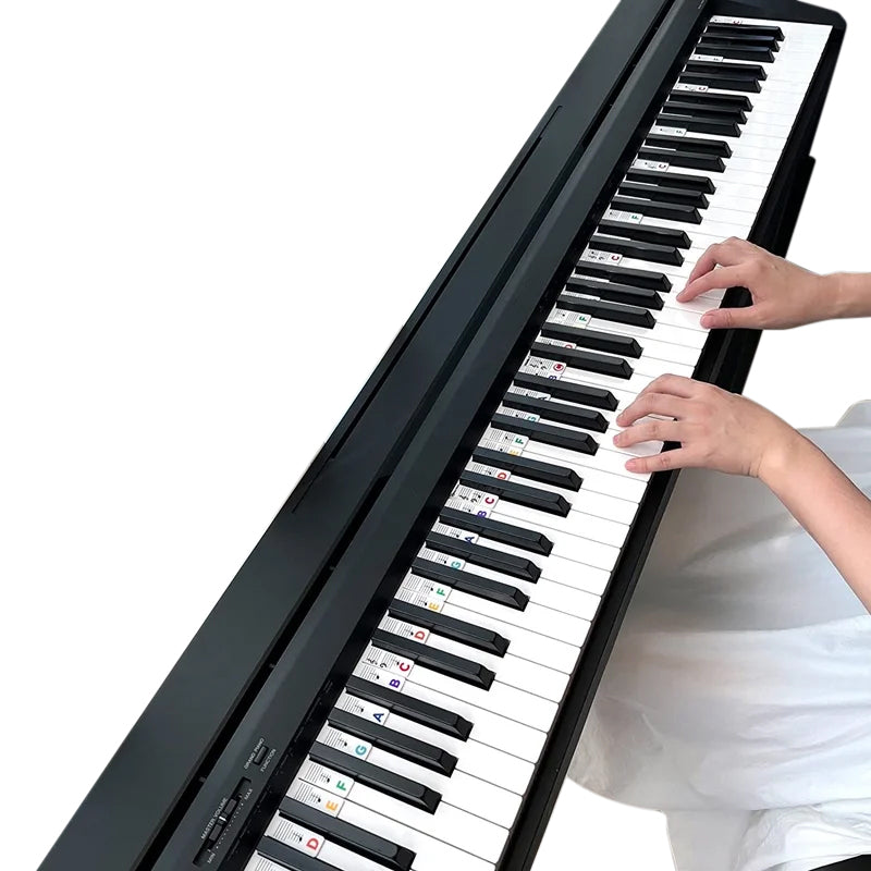 "Piano silikonetiketter for nybegynnere, fargerike avtakbare noteskilt som viser diskant- og bassstaver tydelig."