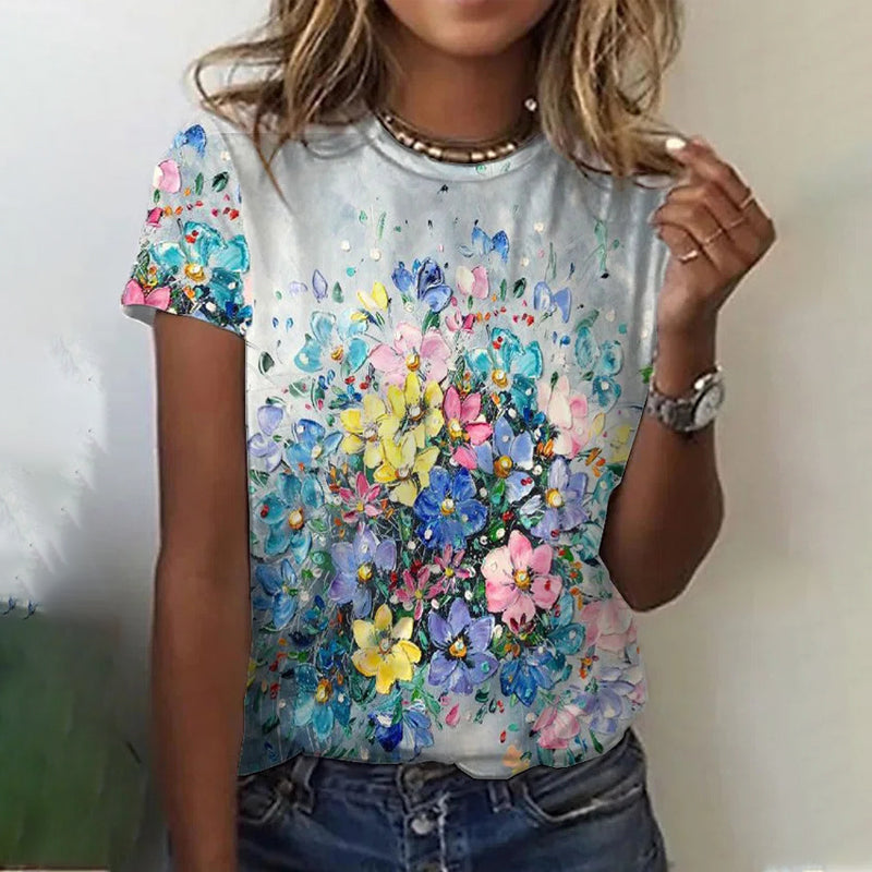"Rund hals kvinnetopp i mykt stoff, dekorert med blomster og sommerfugler, ideell for casual stil og komfort."