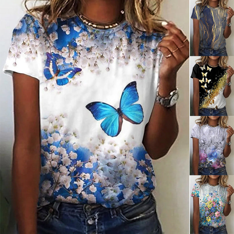 "Rund hals kvinnetopp i mykt stoff, dekorert med blomster og sommerfugler, ideell for casual stil og komfort."