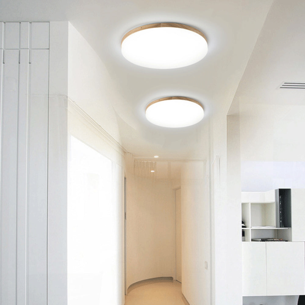 "Rund LED taklampe i akryl, elegant design, energieffektiv, moderne belysning, jevn lysfordeling, stilren interiør."