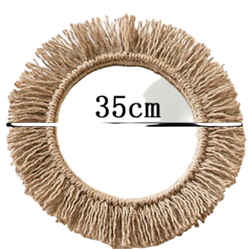 Rundt veggspeil i boho stil med flettet hampetau, ideelt for hyggelig hjemmedekorasjon med naturlige materialer.