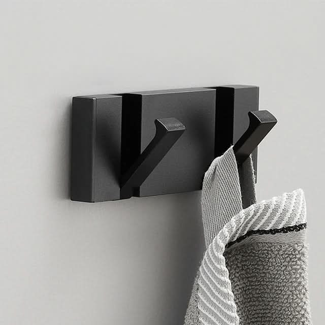 Plassbesparende veggkrok i svart, perfekt for minimalistisk design i gang og bad.