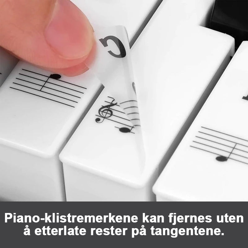 "Slitesterke pianotangent-klistremerker på gjennomsiktig vinyl med fargerike noter for enkel notelæring."