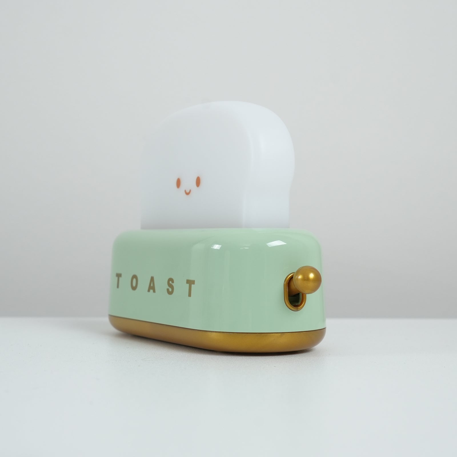 "Søt bordlampe i brødristerform, trådløs, oppladbar, i metalliakryl, justerbar lysstyrke, grønn, mandelgul, rosa."