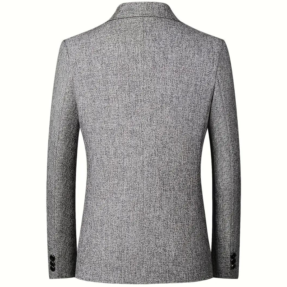 "Stilfull grå sommerblazer for menn med klassisk revers og to knapper, perfekt for både kontor og festligheter."