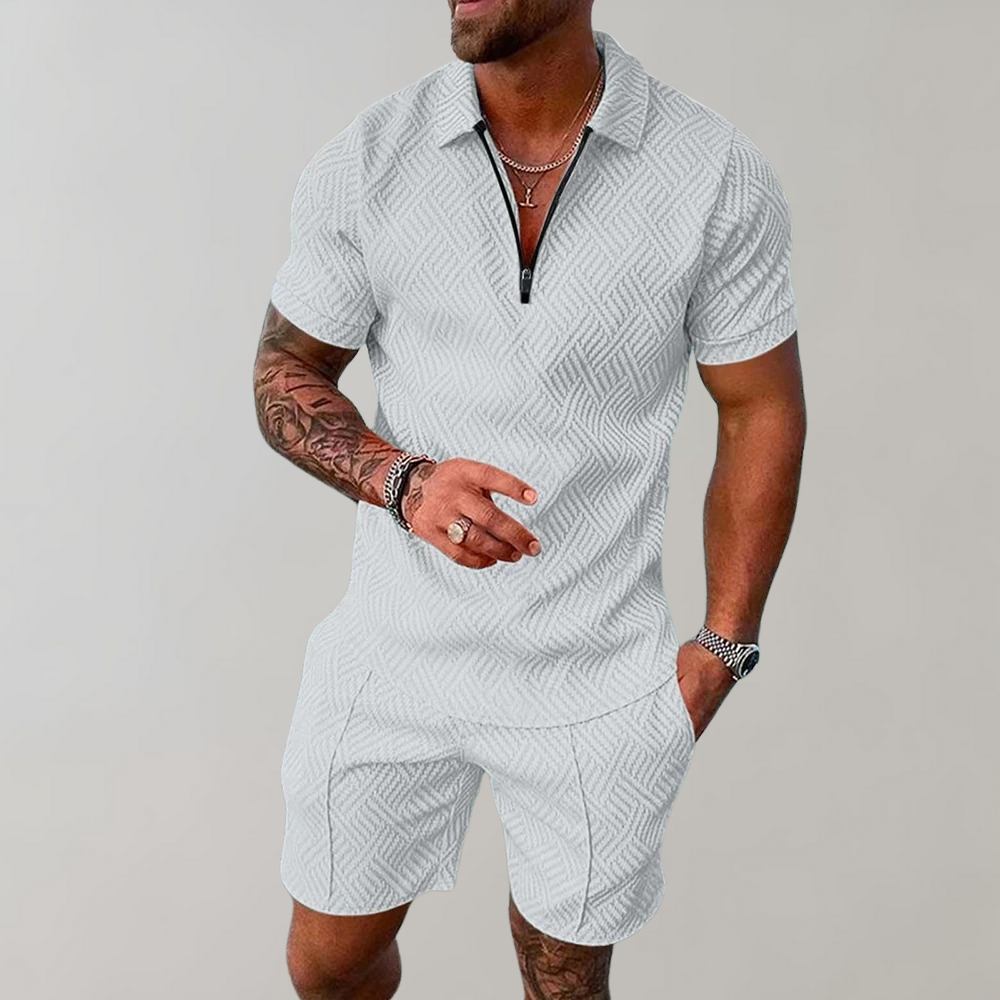 "Stilig poloshirt og shorts for menn i marineblå, perfekt for sommeren med komfortabel passform og elastisk midje."