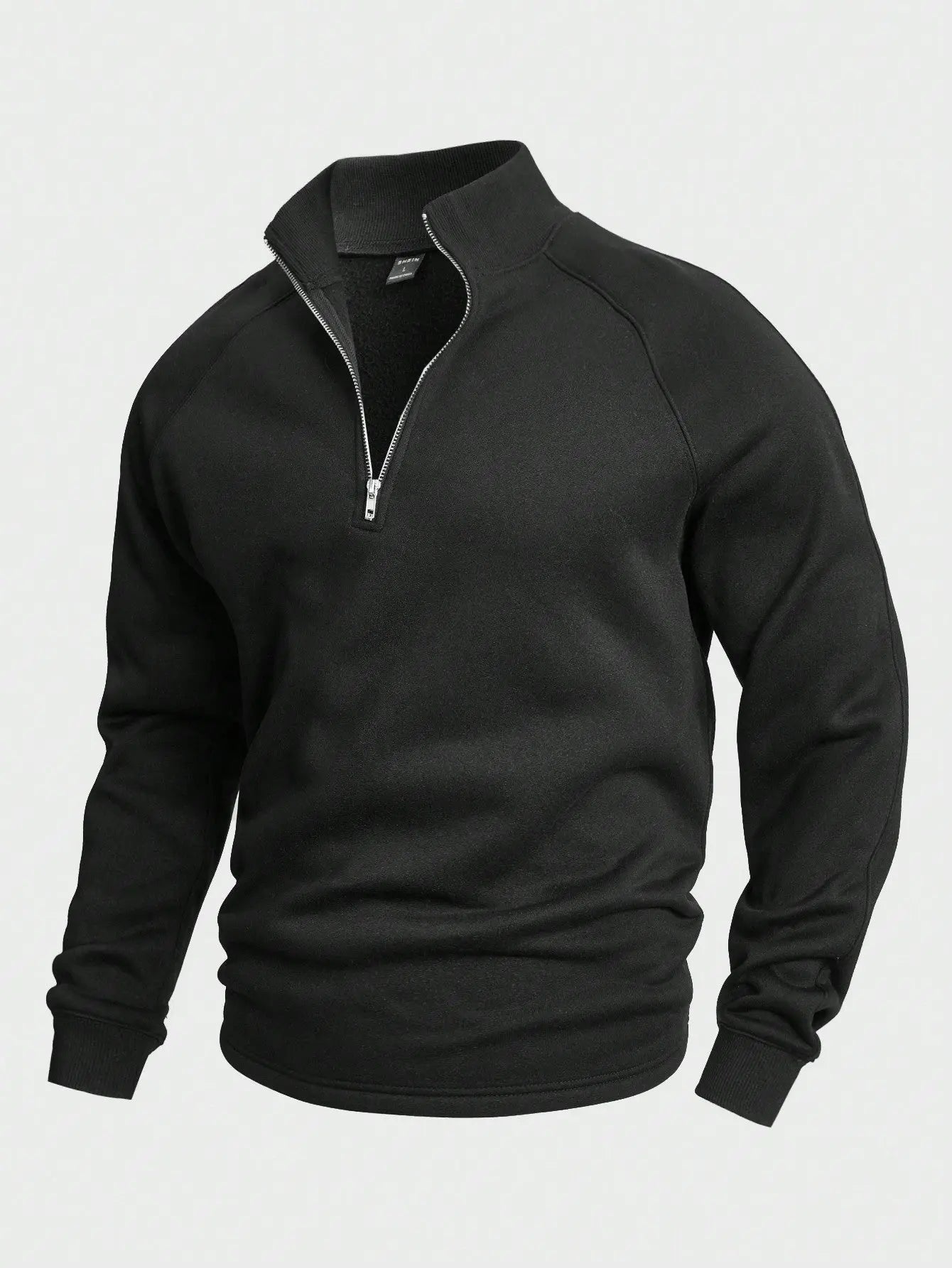 Detaljebilde av den behagelige halv-zip genseren for menn, viser sømmer og tekstur i stoffet.