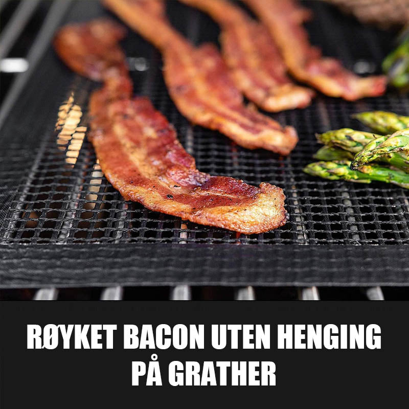 "Svart premium grillmatte 40x33cm, varmebestandig og lett å rengjøre, beskytter mot mat som faller gjennom grillen."