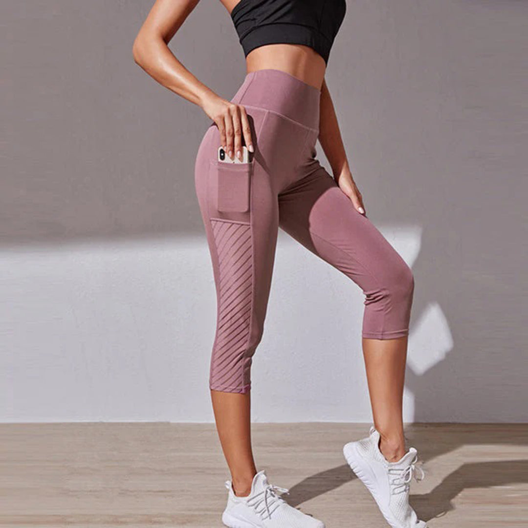 "Svarte LORA leggings for kvinner, hurtigtørkende og sømløse, fremstilt i pustende materiale for stil og komfort."