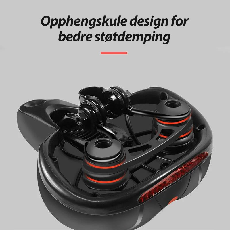 "Sykkel setepute i myk silikon med pustende design, uthevet i blått med luftehull for maksimal komfort på lange turer."