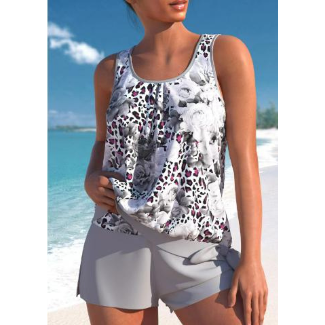 Ermeløs tankini for kvinner med elegant blomsterdesign. Pustende og komfortabelt badetøy for sommer og basseng.