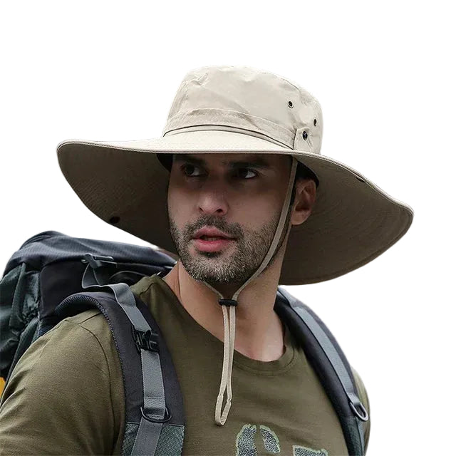 Unisex bøttehatt i nøytral farge med justerbar hakestropp, perfekt for utendørsaktiviteter og solbeskyttelse.