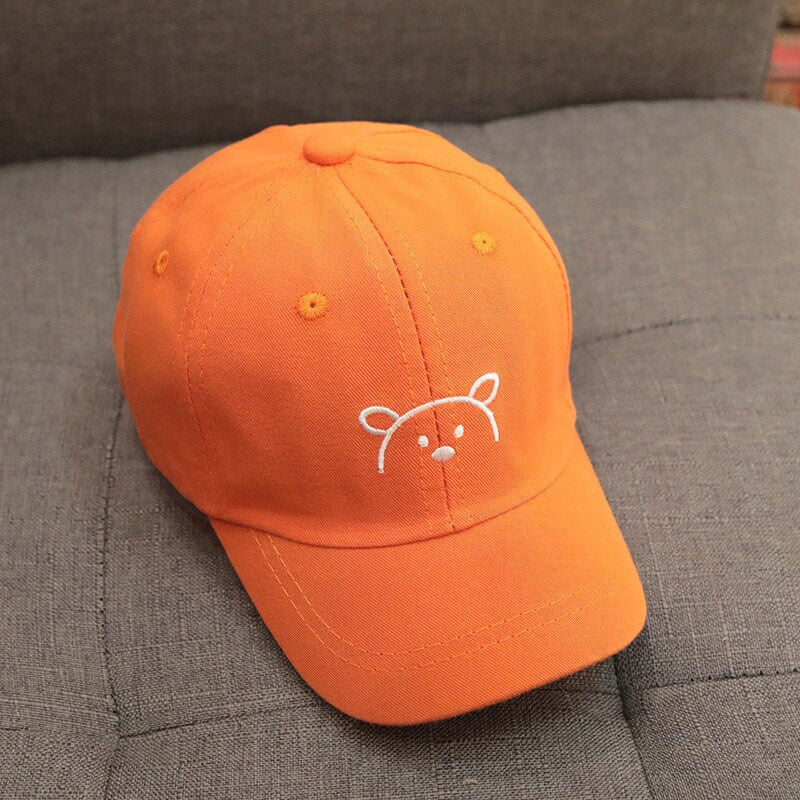 Unisex bomullsmiks solhatt for barn med bjørneører. Justerbar passform gir optimal solbeskyttelse.