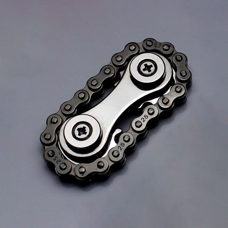 Elegant metall fingertuppkjede med roterende svinghjul. Perfekt for angstlindring og konsentrasjon.
