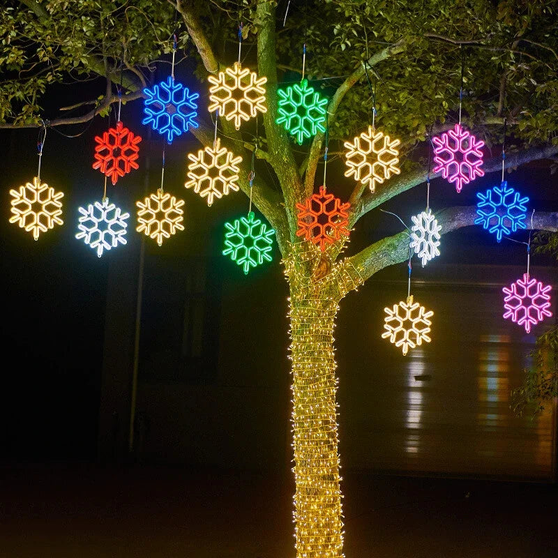 Vanntett utendørs LED-snøfnugglys med glødende snøfnugg i fall, IP65, flere farger, perfekt for juledekorasjon.