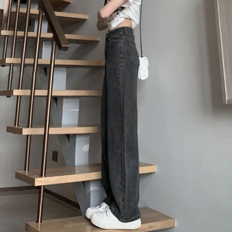 Detaljer av den slitesterke denimkvaliteten på vintage vidbeinsjeans dame.