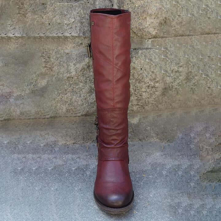 Brune vintage skinnstøvler, et par damesko med glidelås, ideelle for vinterbruk.
