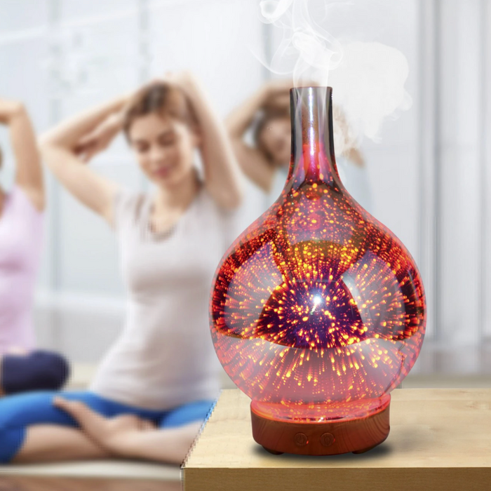 Avslappende aroma diffusor og luftfukter i glassvase med fargeskiftende LED-lys for velvære og ro.