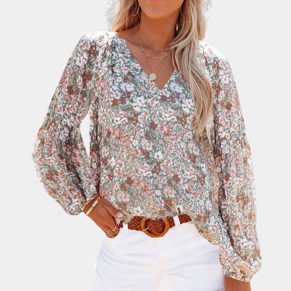 Amya Blomstret Sommerbluse; elegant bluse i livlige farger og blomsterdesign, perfekt for sommerlige anledninger.