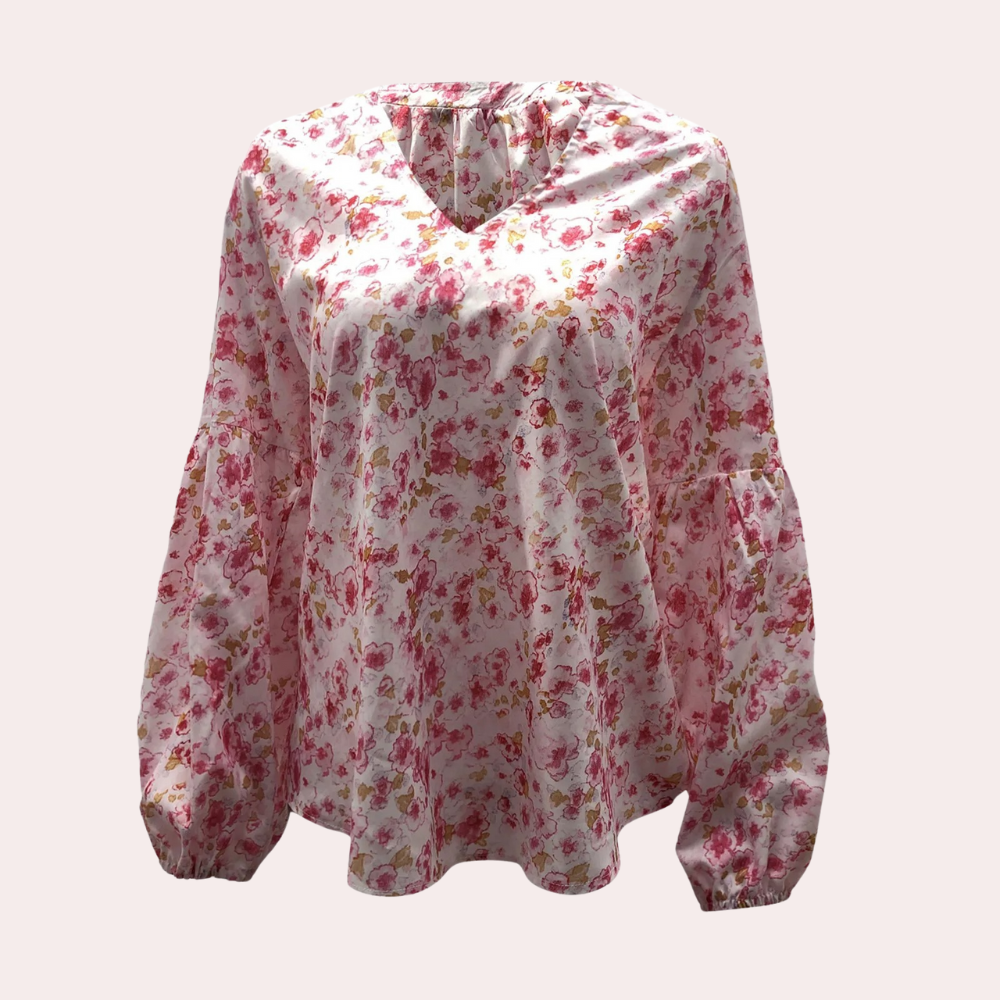 Amya Blomstret Sommerbluse; elegant bluse i livlige farger og blomsterdesign, perfekt for sommerlige anledninger.
