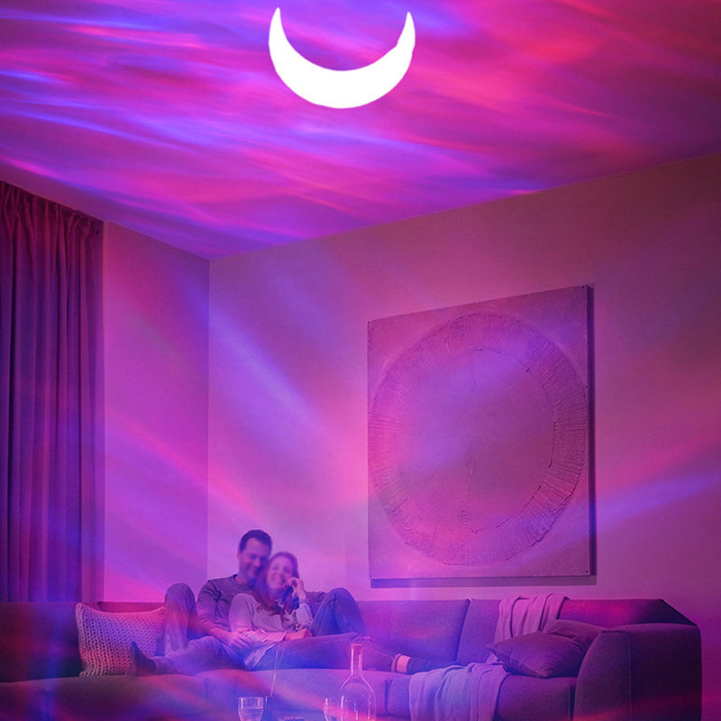 "Auroraprojektor med galakselys i rommet, elegant svart-hvitt design, Bluetooth-høyttaler for dynamisk lysopplevelse."