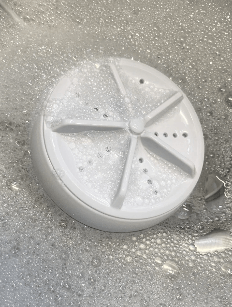 Effektiv bærbar vaskemaskin med ultralyd for hygiene på tur og i små hjem.