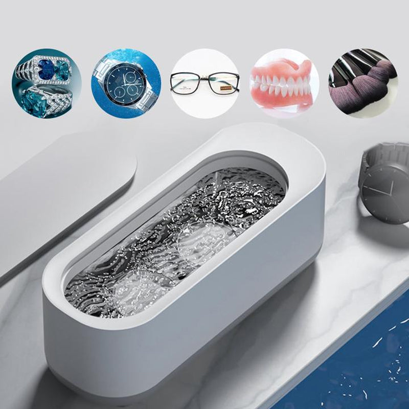 "Bærbar hvit og grå ultralydrensemaskin med høy kapasitet for smykker, briller og klokker, stillegående design."