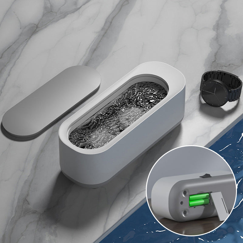 "Bærbar hvit og grå ultralydrensemaskin med høy kapasitet for smykker, briller og klokker, stillegående design."