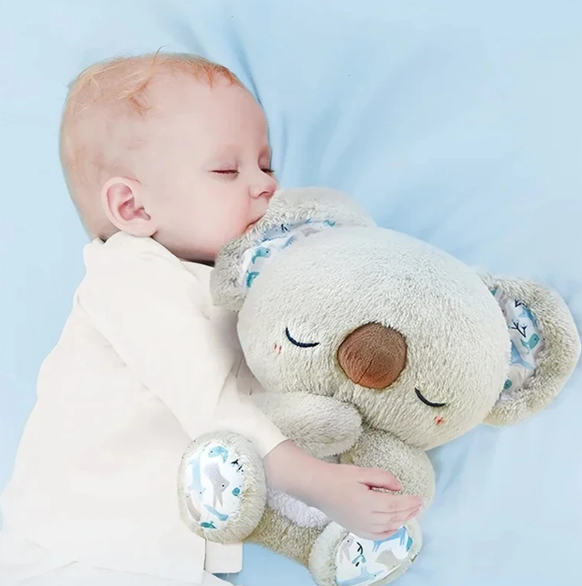 Multisensorisk koala kosedyr som simulerer pust, med beroligende musikk for søvn og stressreduksjon