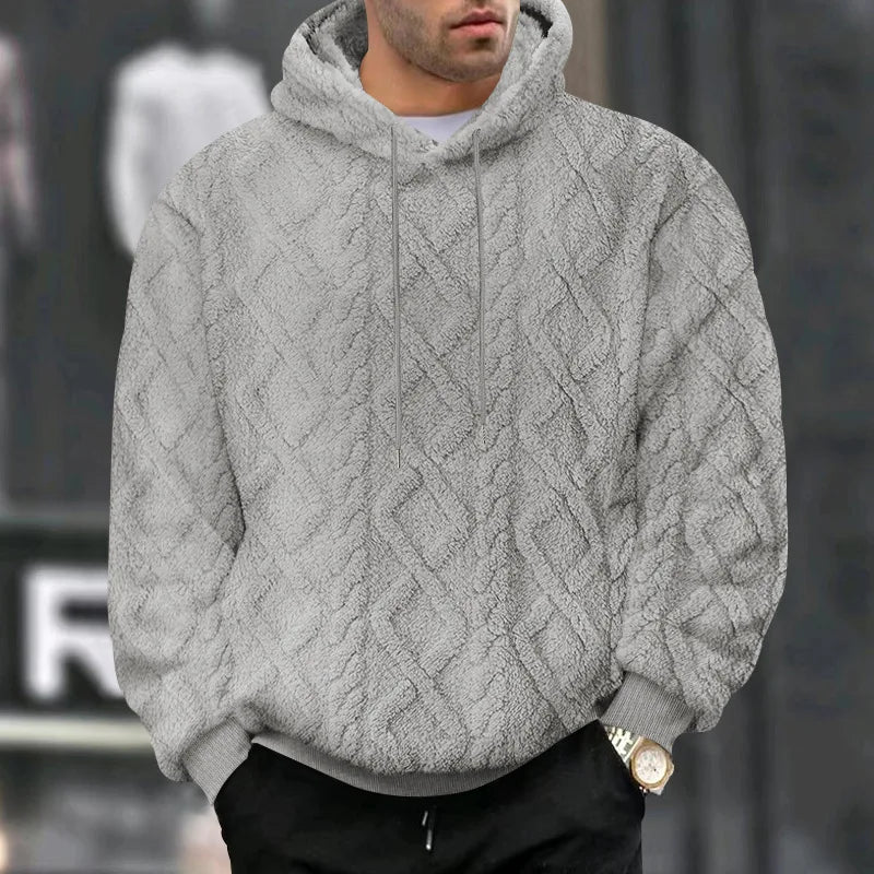 Stilfull svart jacquard hettegenser med hette, ideell for et sporty hverdagsantrekk.