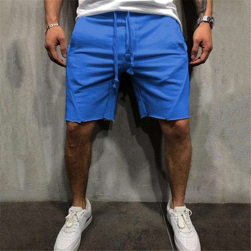 Beige herreklær: løse shorts med elastisk midje og snøring for optimal komfort.