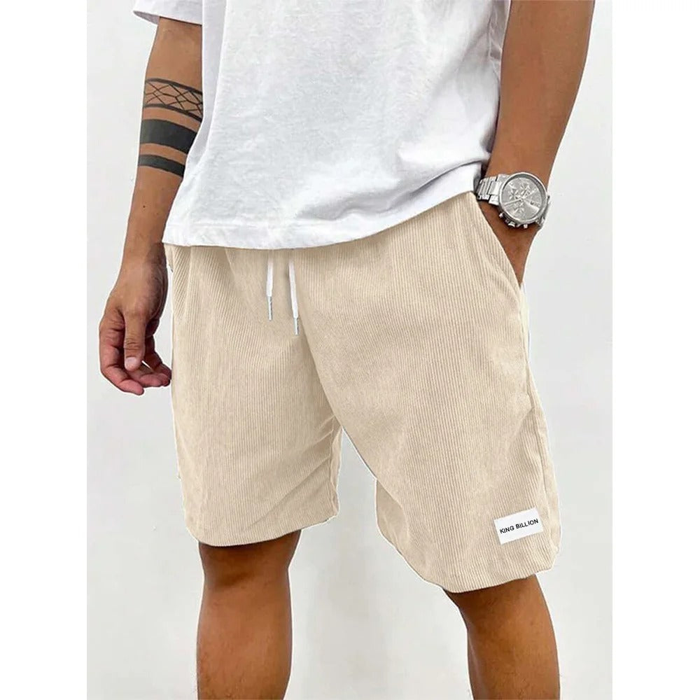 "Blå corduroy-shorts for menn med myk struktur, avslappet passform, ideell for casual stil og uformelle utflukter."