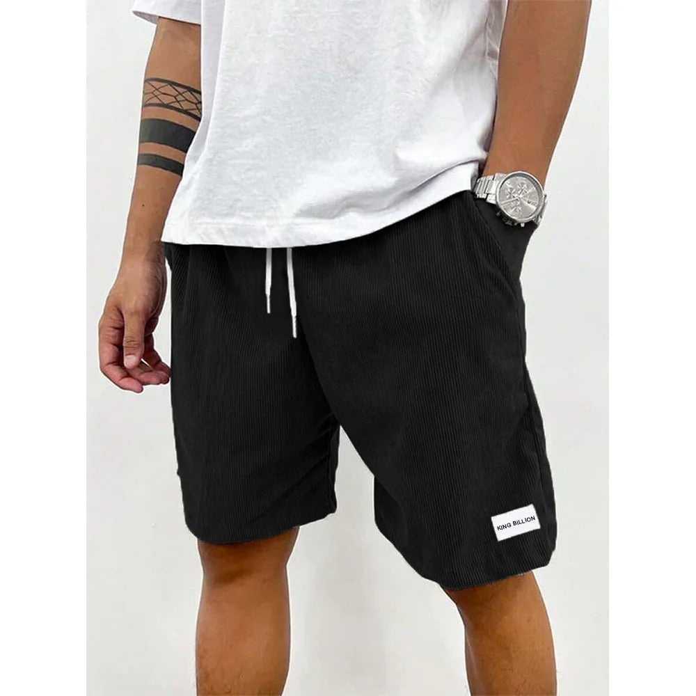 "Blå corduroy-shorts for menn med myk struktur, avslappet passform, ideell for casual stil og uformelle utflukter."
